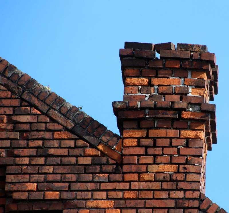 Signs Your Melrose Park Home Needs a Chimney Inspection Damaged chimney on an Melrose Park home showing cracks and missing mortar